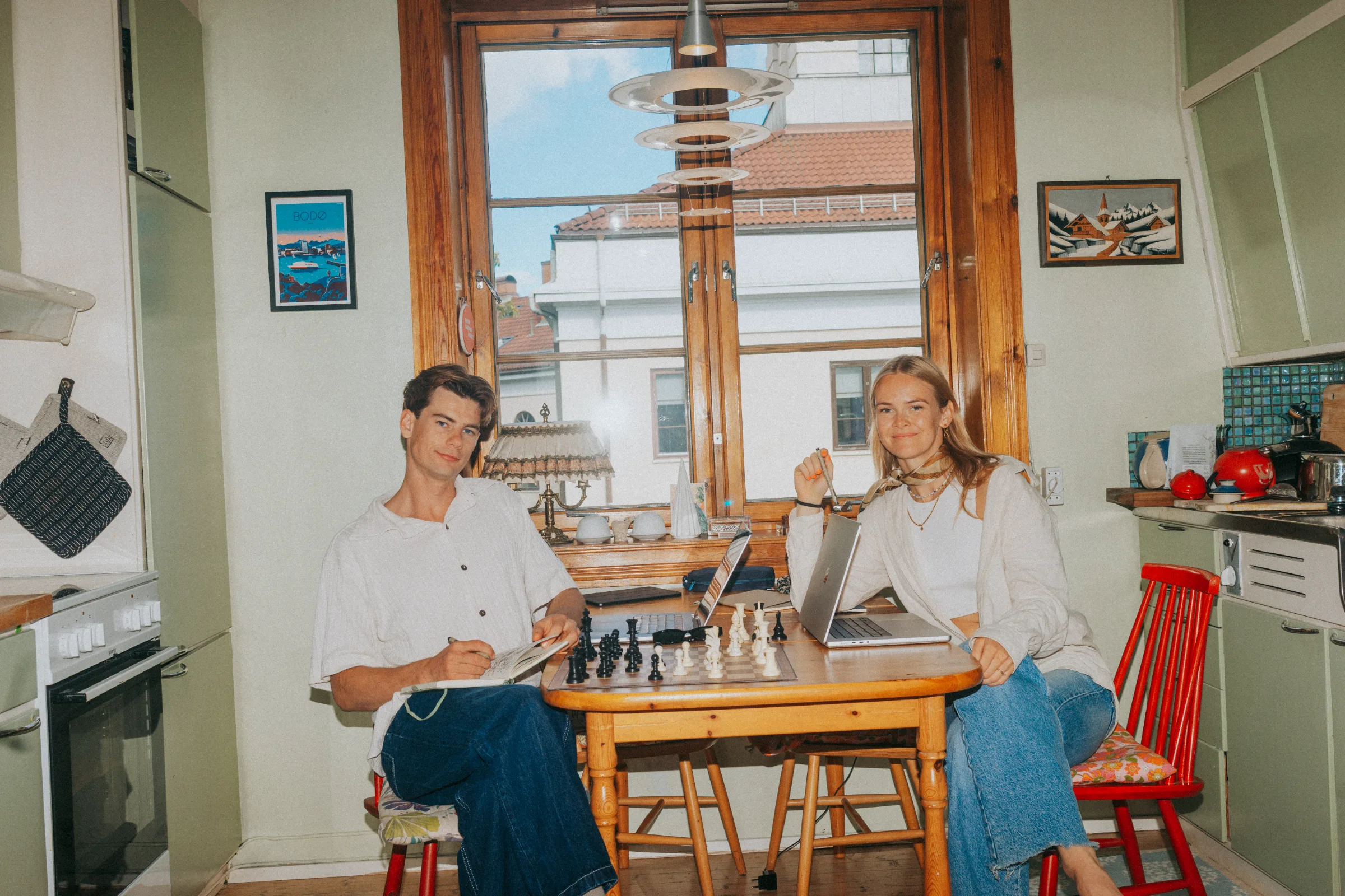 Elias and Ida at the kitchen table, mid-game