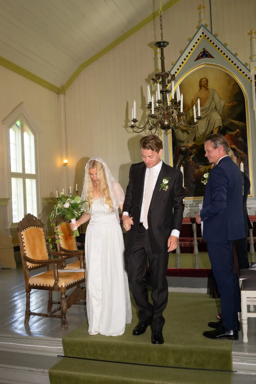 The couple walking down the aisle